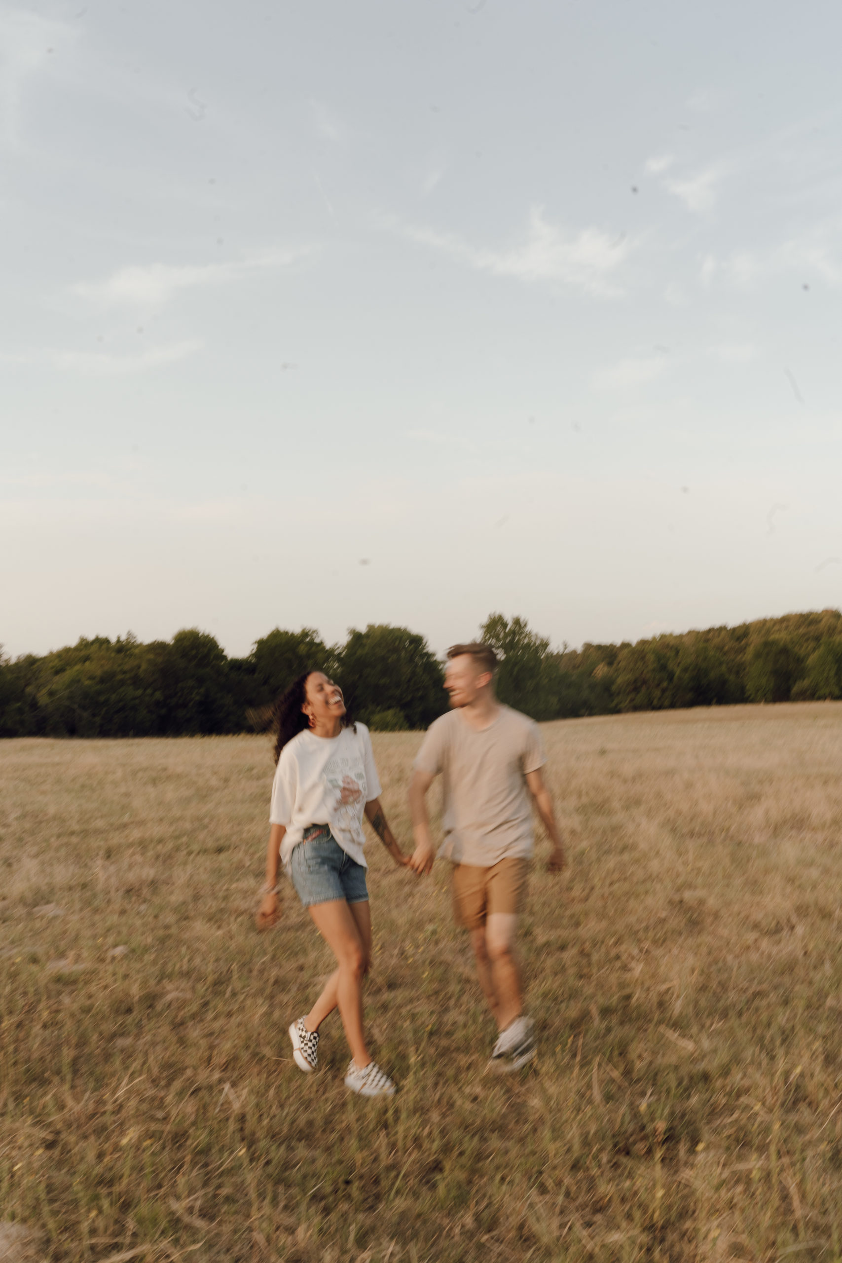 Motion blur of couple in love in the hay field.