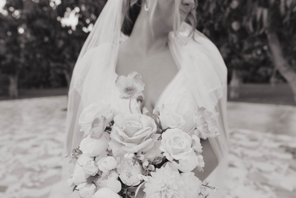 black and white bride holding floral bouquet