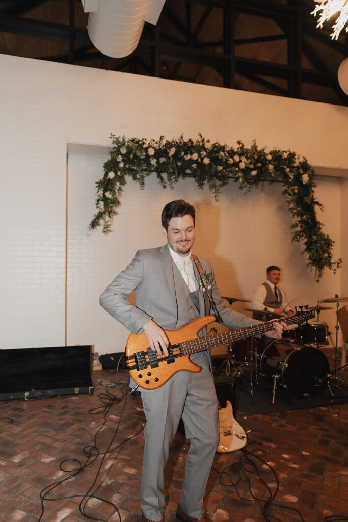 groom playing guitar