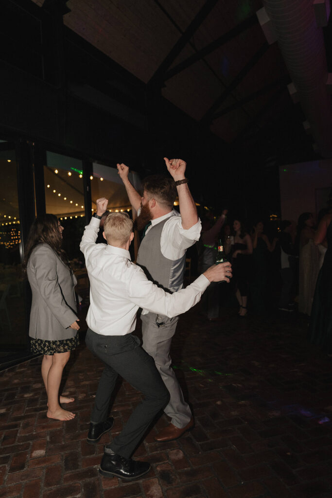 wedding guests dancing at reception