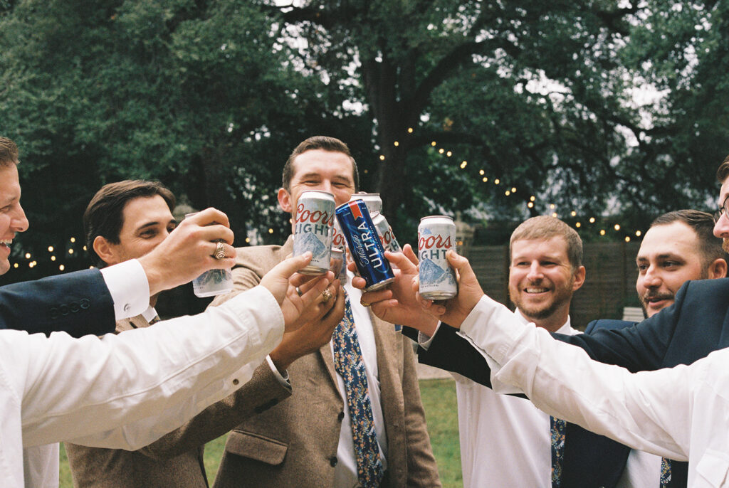 groomsmen cheers with beer on film 