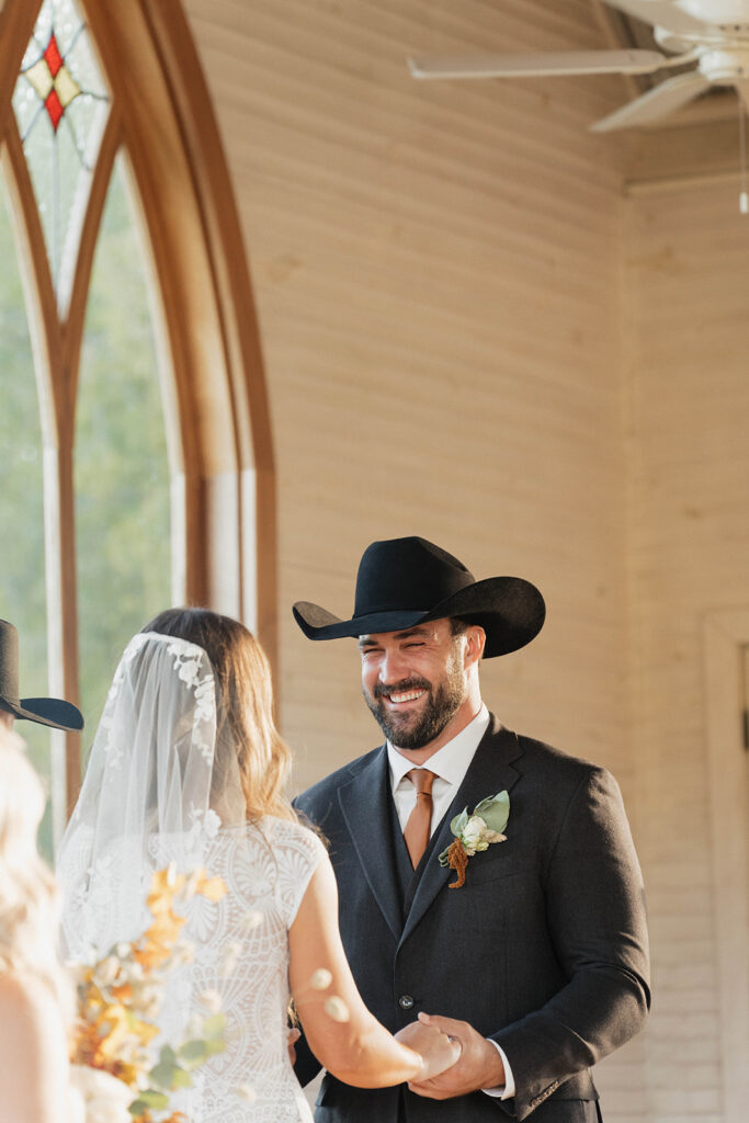 bride and groom exchanging vows in a classy western wedding ceremony.