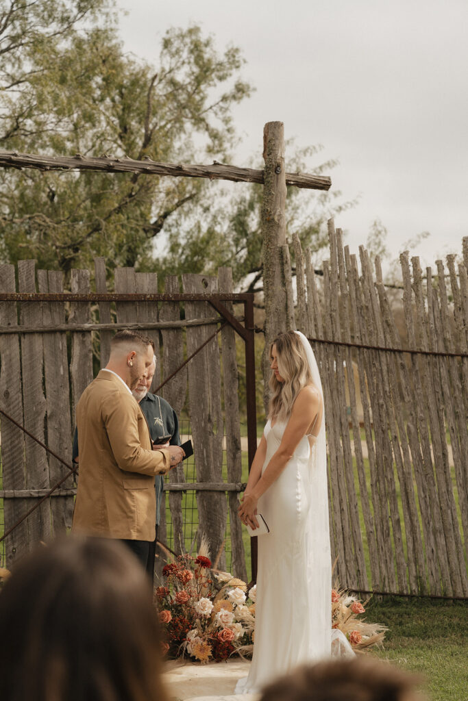 elopement ceremony on the lawn at the couple's texas wedding venue