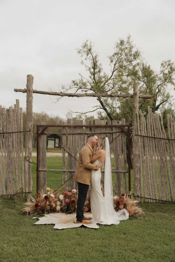 elopement ceremony on the lawn at the couple's texas wedding venue