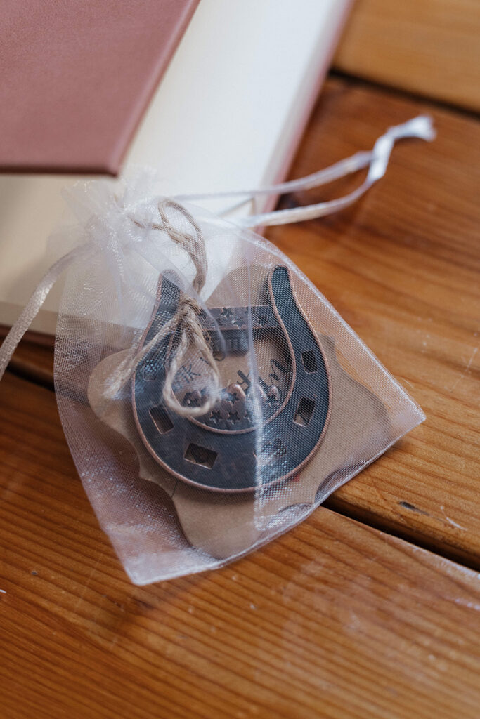 Horseshoes arranged as charming wedding favors, symbolizing luck and adding a rustic element to the classy western wedding.